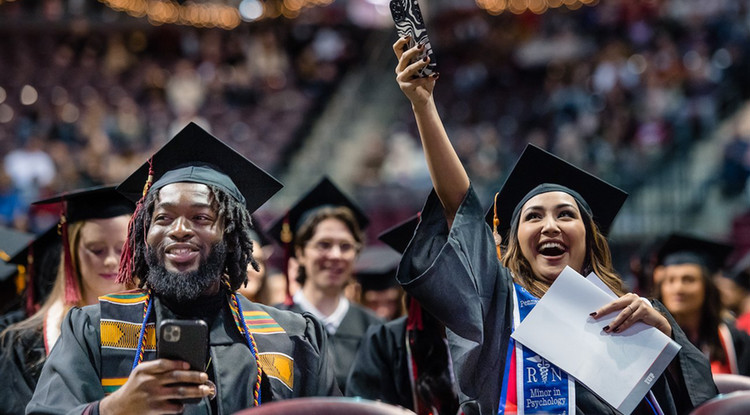 Students celebrating at a graduation commencement ceremony