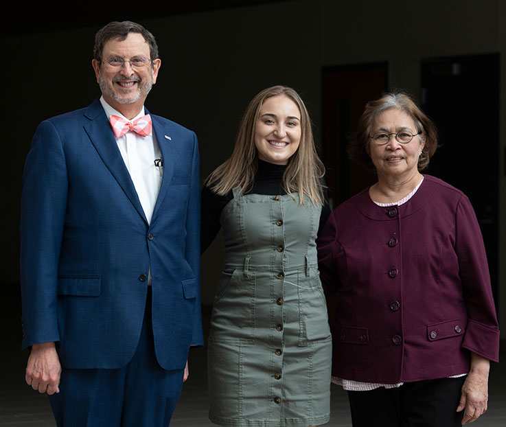 IUP President Michael Driscoll, scholarship recipient Kendra Bass, and Ilse Hilliard, mother of the late Patricia Hilliard Robertson