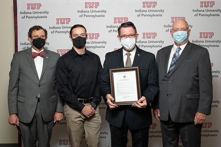 From left, IUP President Michael Driscoll; Tom Lyttle, son of the late Mary Jo Lyttle and Kim Lyttle; Kim Lyttle; Carl Johnson