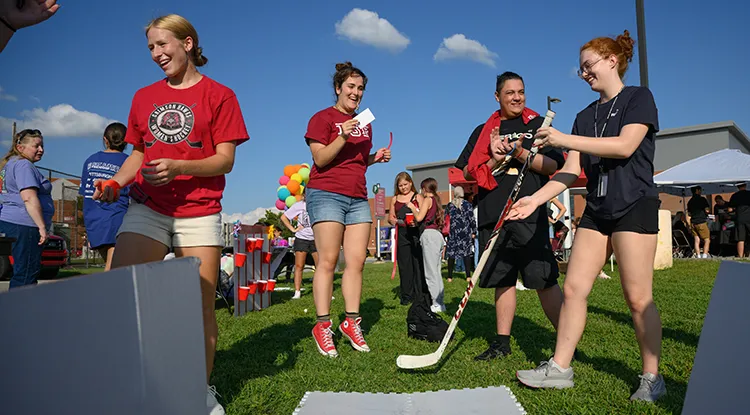 Students playing a hockey based carnival game