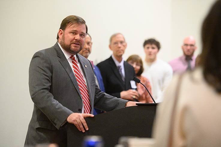 Senator Pittman speaking at the podium 