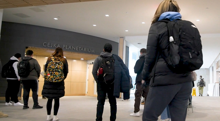 Studentds waiting outside the Cejka Planetarium doors