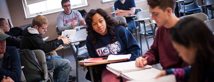 Students reading and studying in a classroom