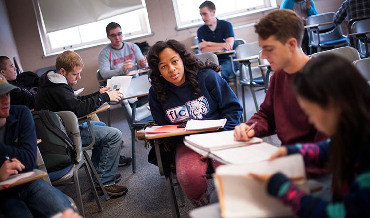 Students reading and studying in a classroom