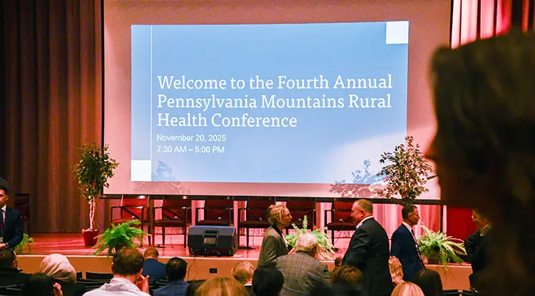Attendees gather in an auditorium as they are welcomed to the Fourth Annual Pennsylvania Mountains Rural Health Conference.