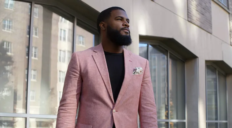 Portrait of Jeremy McCool standing outside a building