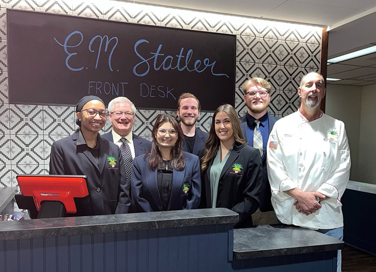 Hotel, restaurant, tourism, and event management majors with Stephen Shiring and Chef Jeffery Santicola, chair and faculty member, respectively, of the Department of Hotel, Restaurant, Tourism, and Event Management.