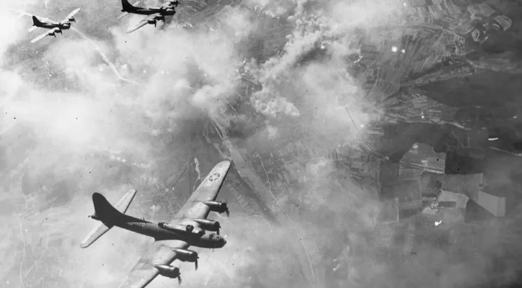 black and white aerial photo of World War 2 era planes flying