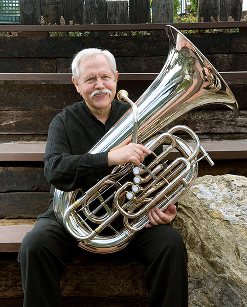 Jim Self holding a tuba