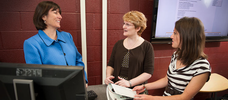 Students talking with professor 