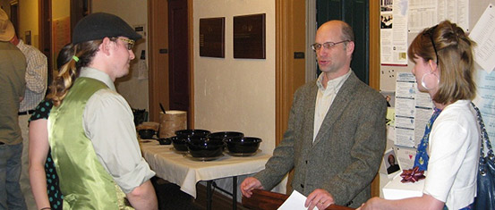Dr. Chandler talks with two students