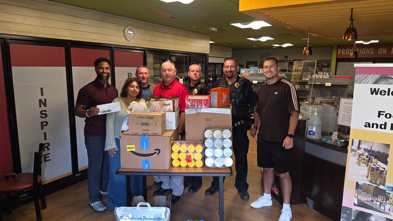 From left, Roger Briscoe II, executive director of Student Inclusion; IUP Public Safety Intern Julliana Vega-Abreu; IUP Police Lieutenant Doug Campbell; IUP Director of Public Safety and Police Tim Stringer; IUP Police Officers Jeff Neal and Mike Porada; and Nicolas Madrid, graduate assistant in the Office of Student Inclusion.