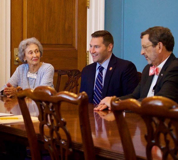 President Driscoll and Malphine Fogel with another person in Washington, DC