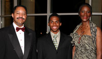 Sutan Magruder, center, receives Presidential Scholarship from Tony Atwater and Beverly Roberts-Atwater