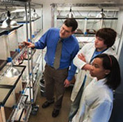 Students in a lab with a Psychology professor