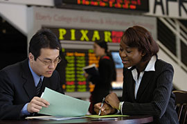 Students consult in the Eberly College of Business and Information Technology.