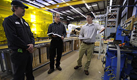 Safety Sciences students work on site in a business.