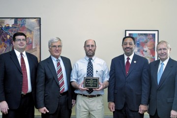 Jonathan Lewis accepting award