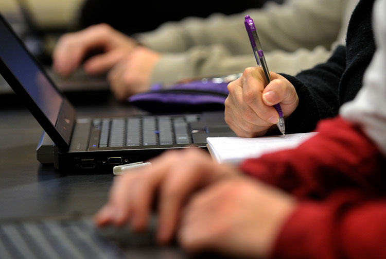 Hnads typing on a keyboard