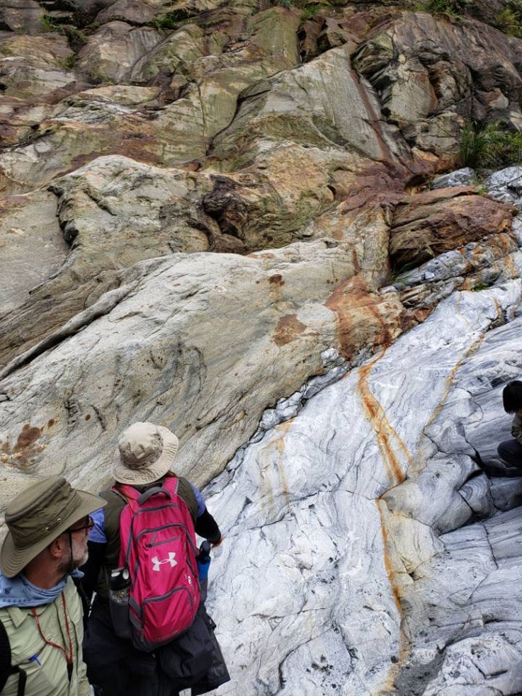 Susie Adams studying rock formations