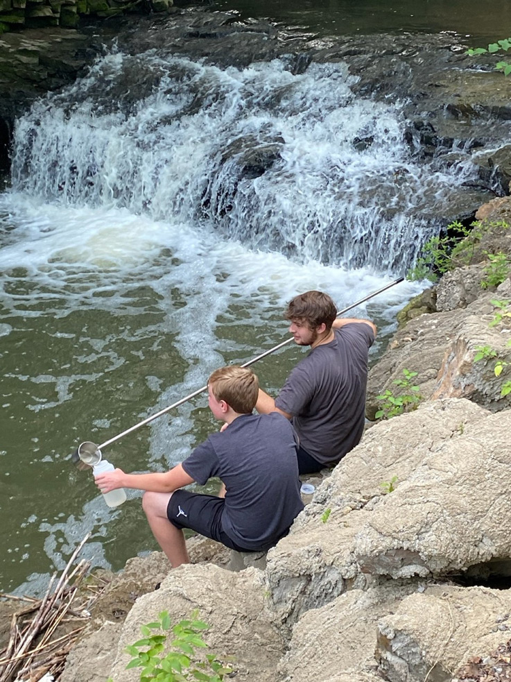 Ryan Francis beside a stream