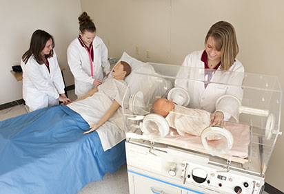 Students working in sim lab
