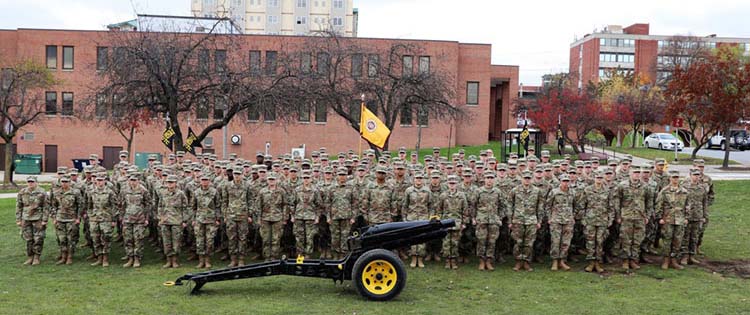 The Cadets and Cadre of Warrior Battalion gather for a picture in the field next to Pierce hall.