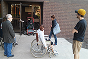 Students check the entrance to Zinc Hall during the wheelchair lab.