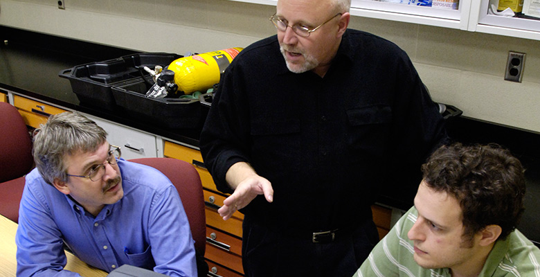 Safety science grad students discuss jobs with professor