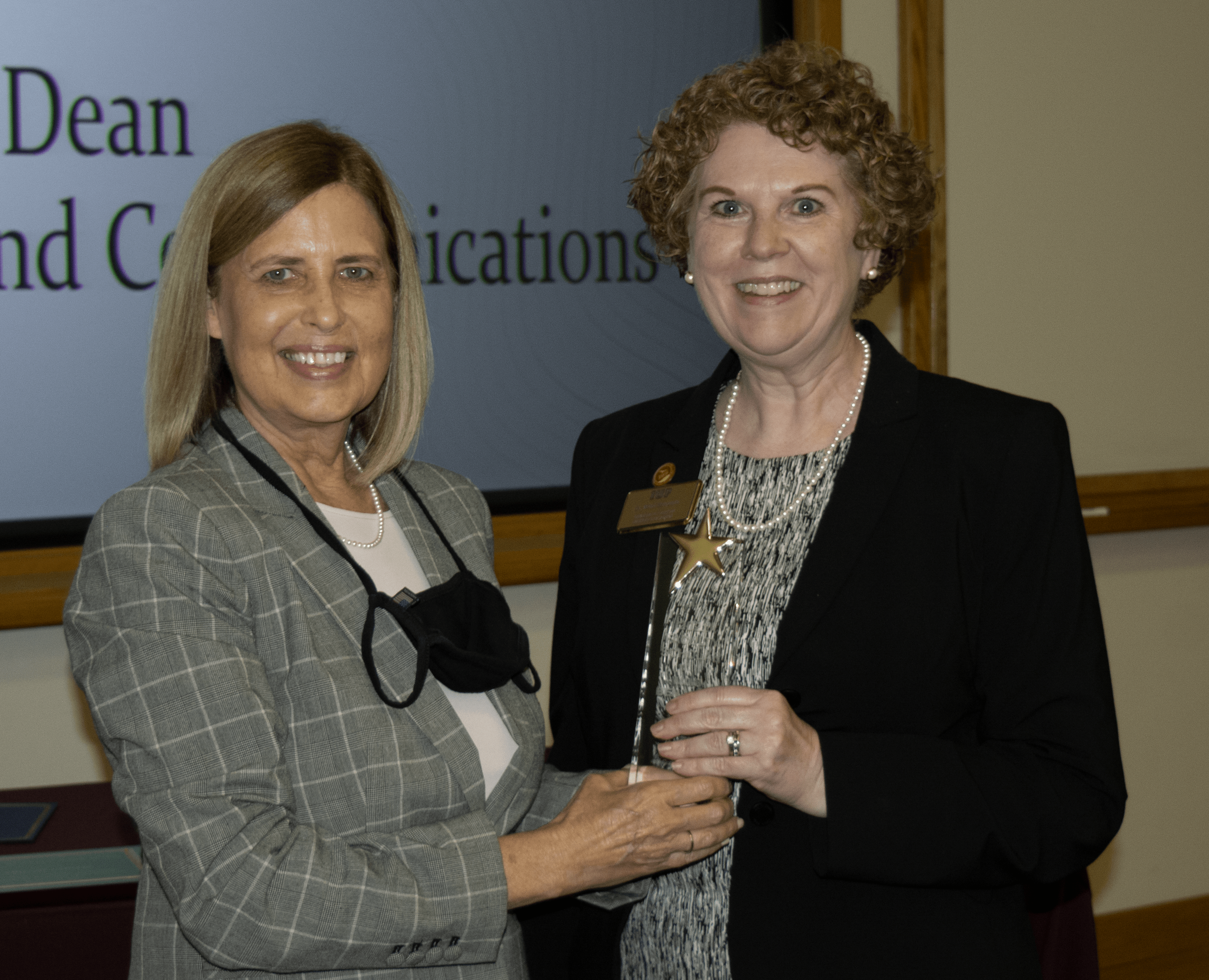 Dr. Mimi Benjamin Receiving COEC Faculty Researcher Award
