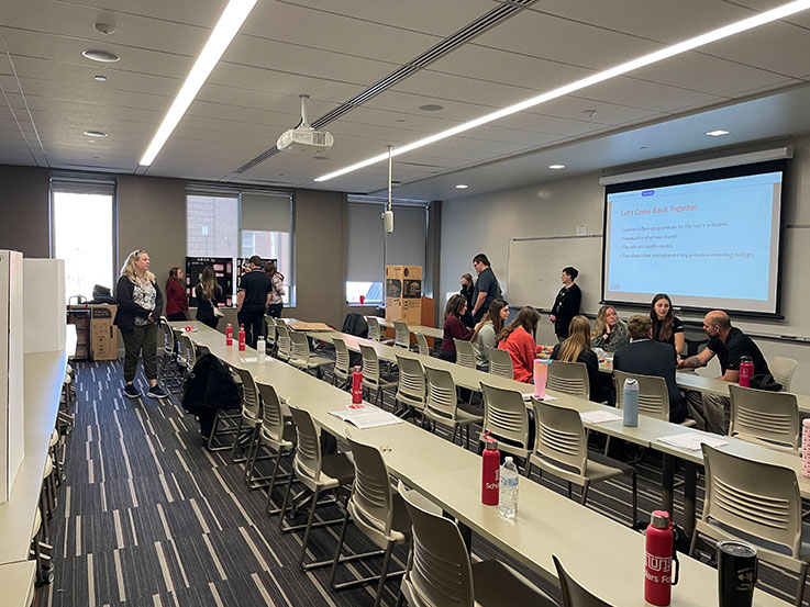 Students gather in classroom for discussion