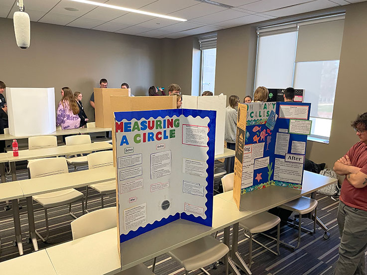 Students review displays in classroom