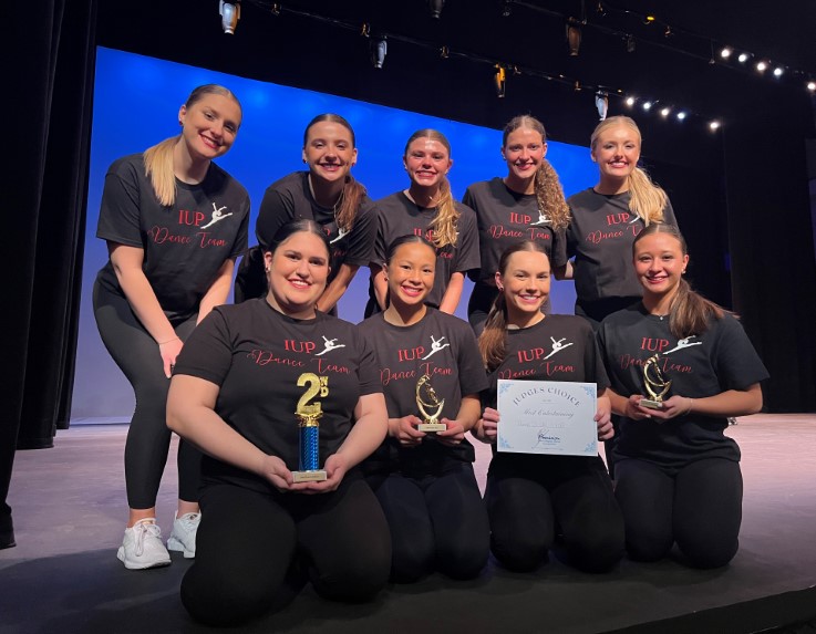 IUP Dance Team show off their wins at the Precision Intercollegiate Dance Competition in March 2024.