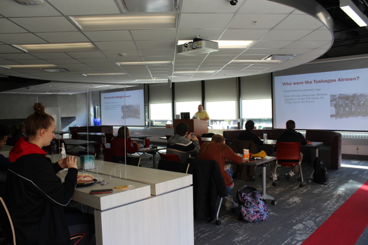 Attendees watch Dr. Shay's presentation.