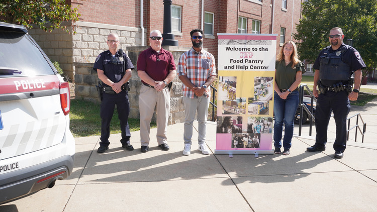 A photo of the IUP University Police and the Executive Director of Student Inclusion donating for the Food Pantry and Help Center