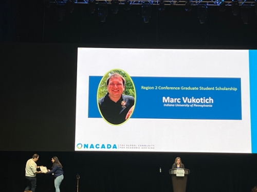 Marc Vukotich, Student Affairs in Higher Education graduate student receives his scholarship award.