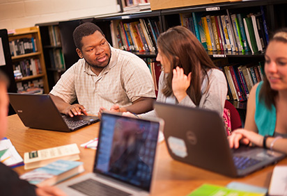 Two students study at a table