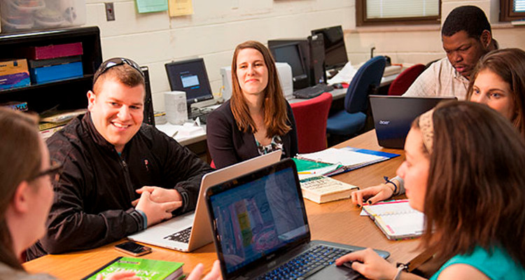 Several students studying at a table