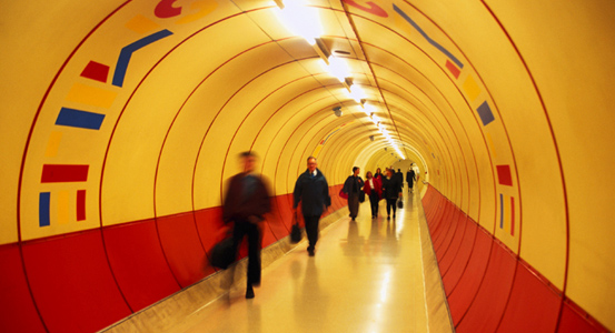 people walking in a subway in a foreign country