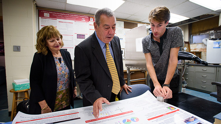 Bill and Audrey Madia with a student