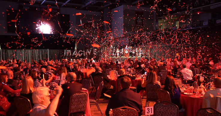 Room full of guests with confetti--celebrating at Celebration of Philanthropy