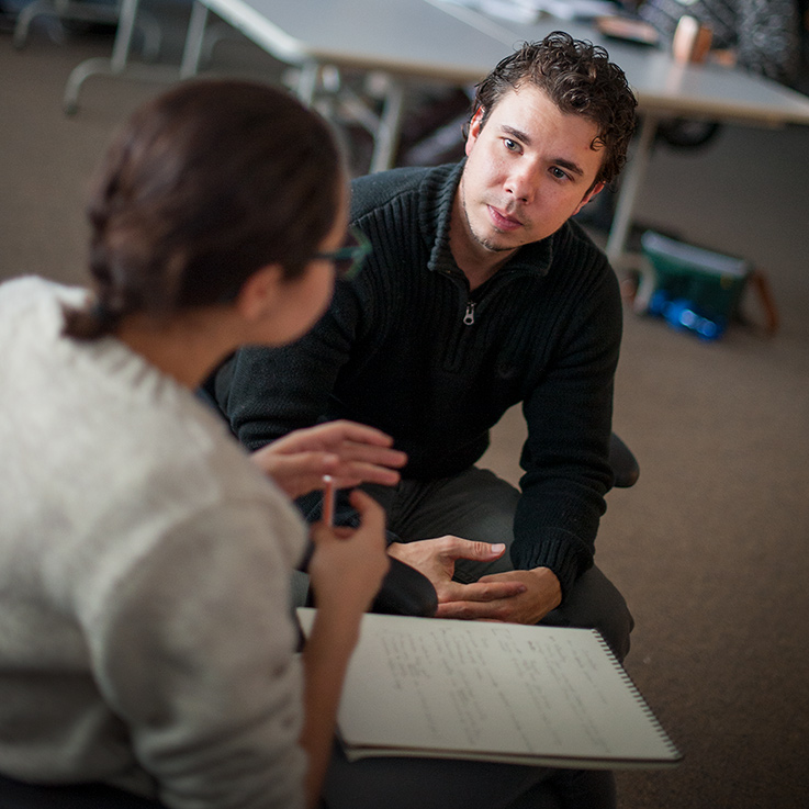 A student talks with their advisor