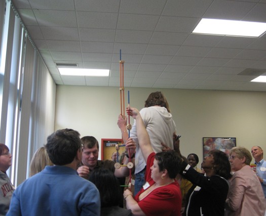 Teams work together to create the tallest structure out of Tinker Toys