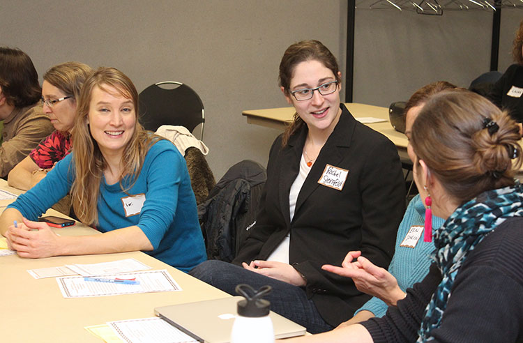 A group of workshop attendees sharing information.