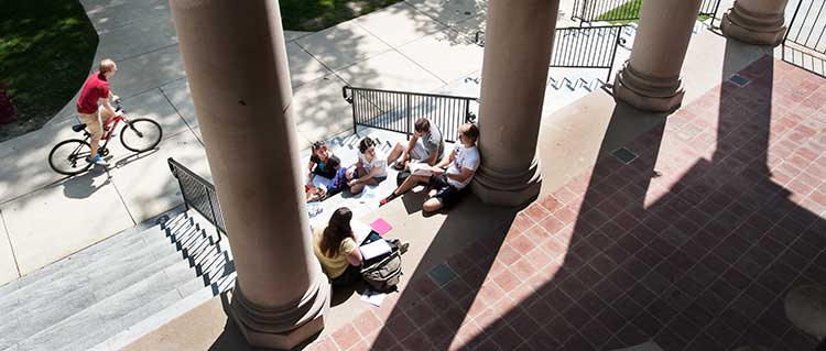 Students hanging out on the steps of Waller Hall.