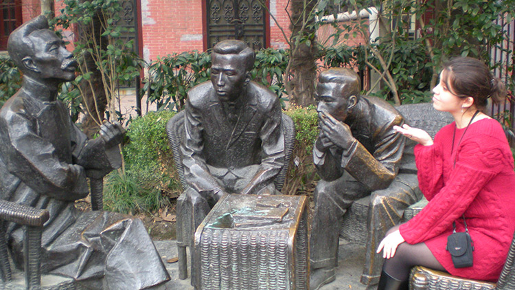 Gina Russo Tam with statues