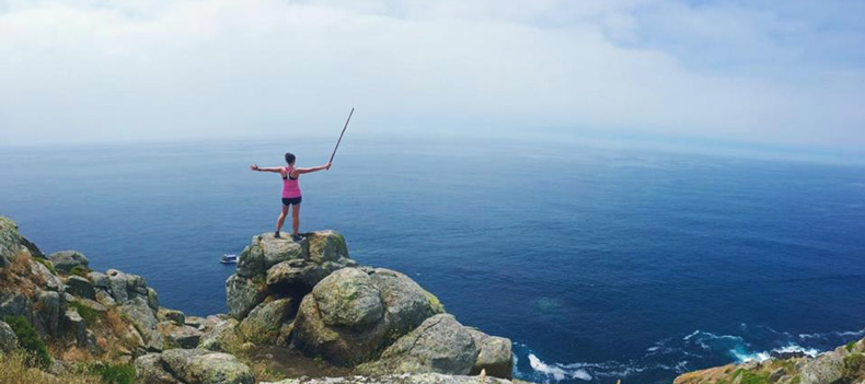 Honors student on rock by the sea Honors student on rock by the sea
