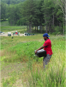 IUP graduate student collecting an air sample near the compressor station at Beaver Run Reservoir