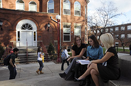 Criminology students talk outside Wilson Hall