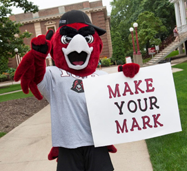 Norm holding a Make Your Mark at IUP sign